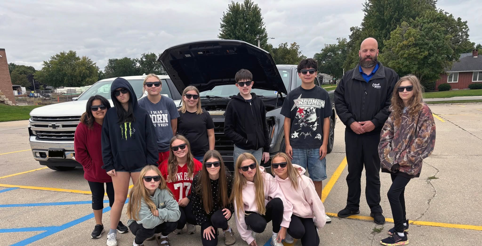 Students working on a car